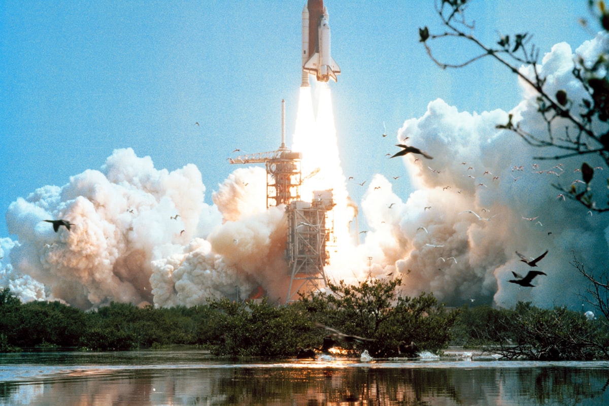 Space shuttle lifting off from the launch pad